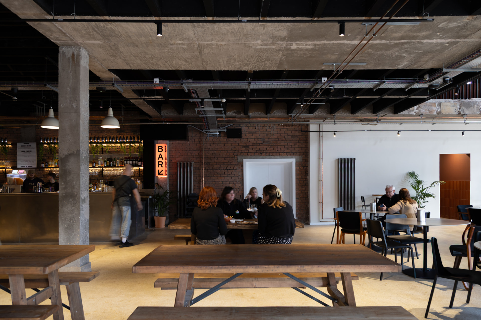 Guests dining inside Hatters Food and Drinks Hall